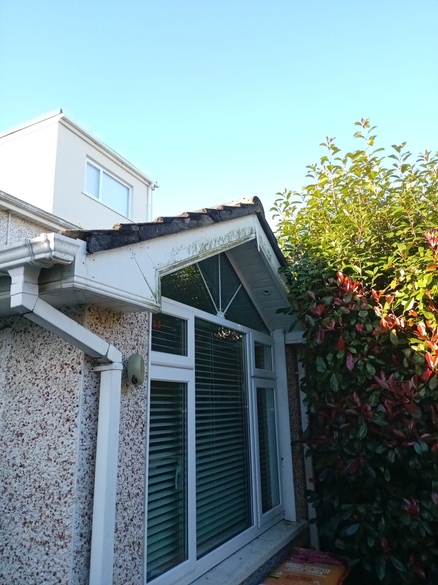 Exposed gable tile ends before dry verge installation on the Clonsilla extension.