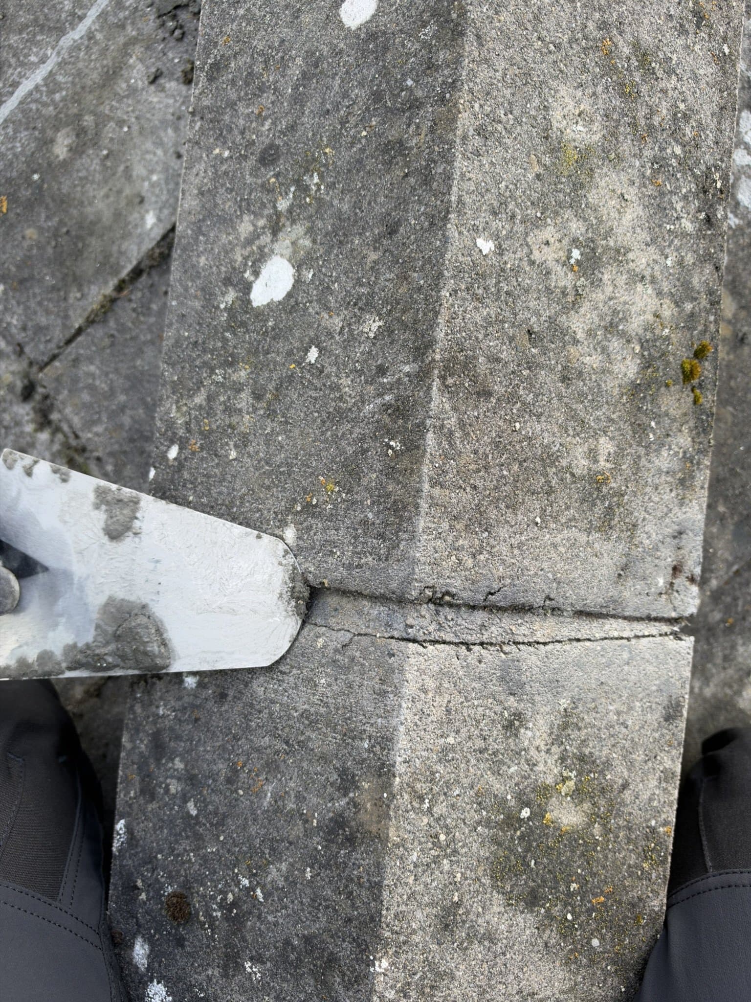Cracked mortar between ridge caps before roof leak repairs in Clonsilla.