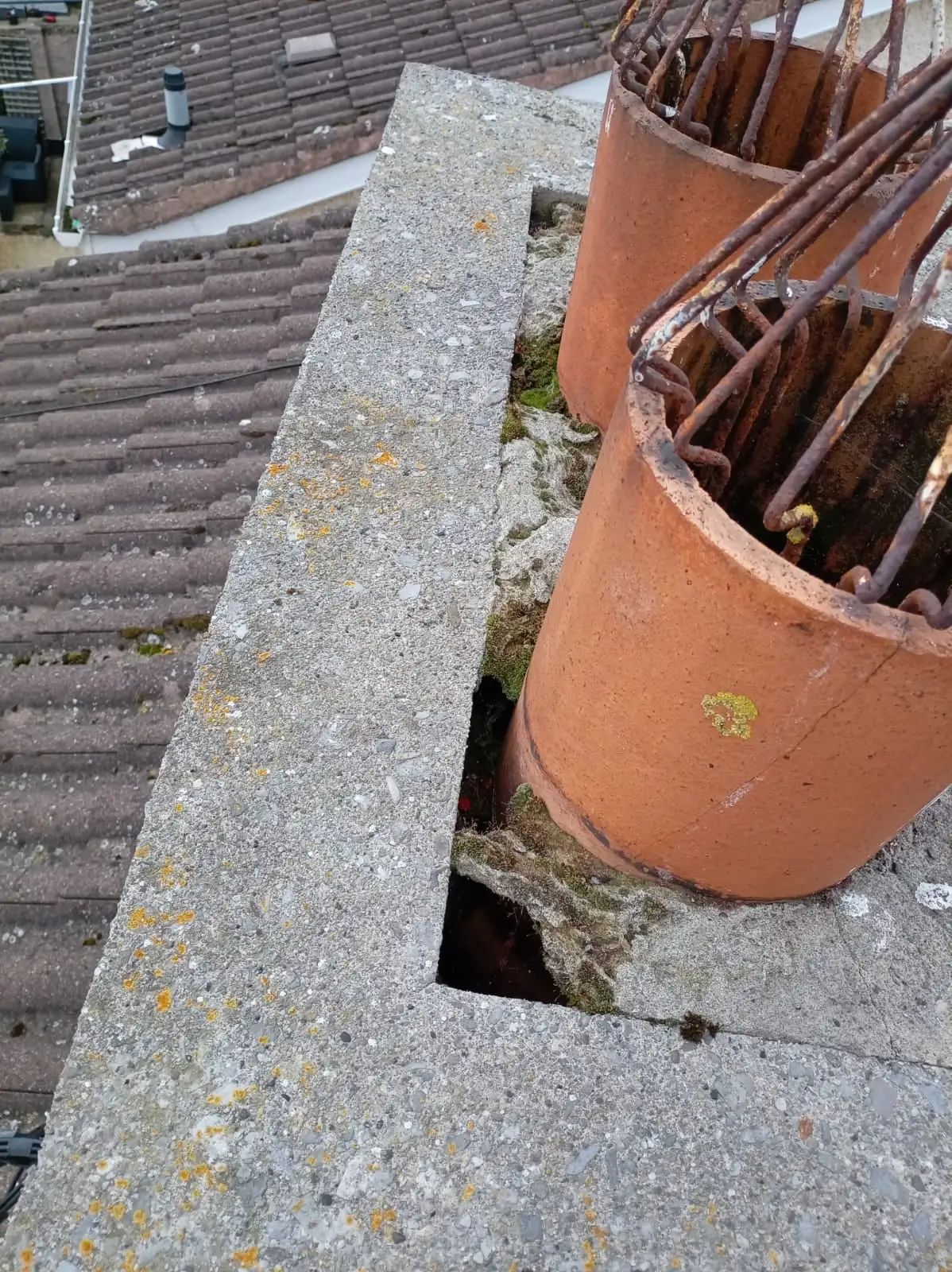 Chimney pots and chimney top before the Whitestown roof work.