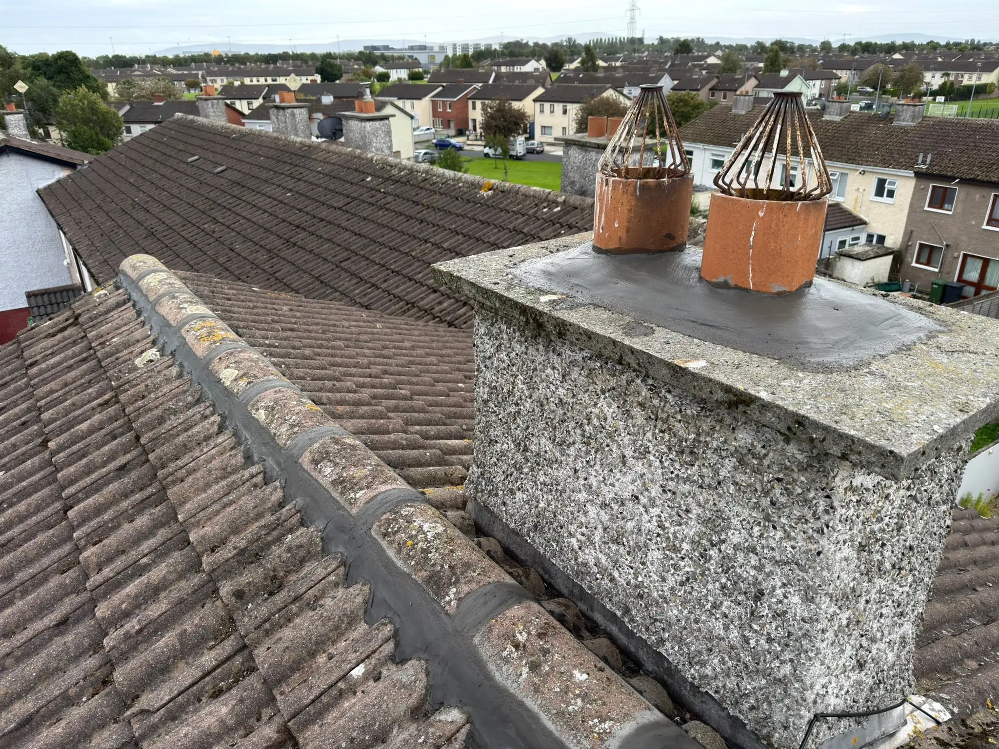 Completed ridge pointing beside the chimney on the Whitestown roof.